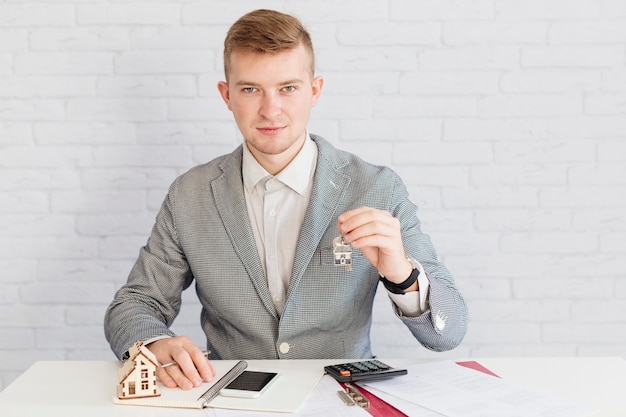 Handsome realtor with keys