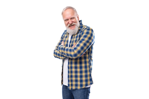 Handsome s mid aged greyhaired man with a beard in a shirt on a white background