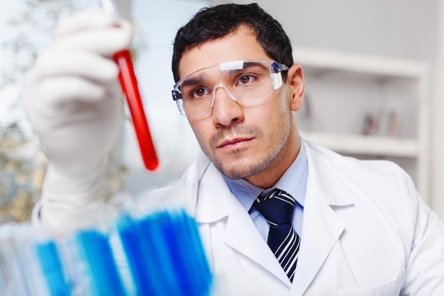 Handsome scientist man working at the laboratory