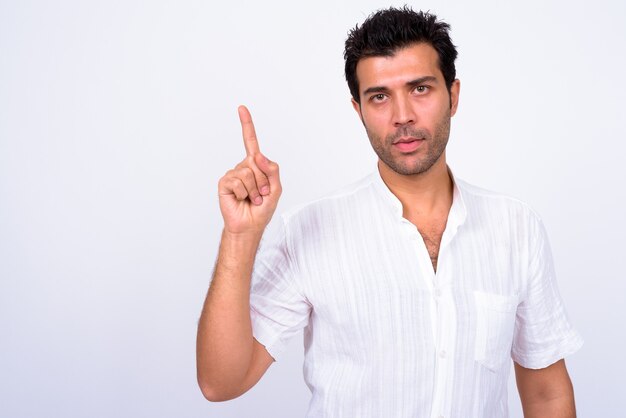  handsome Turkish man against white wall