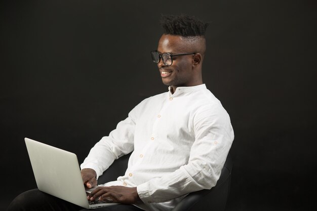 Handsome young African man in white shirt