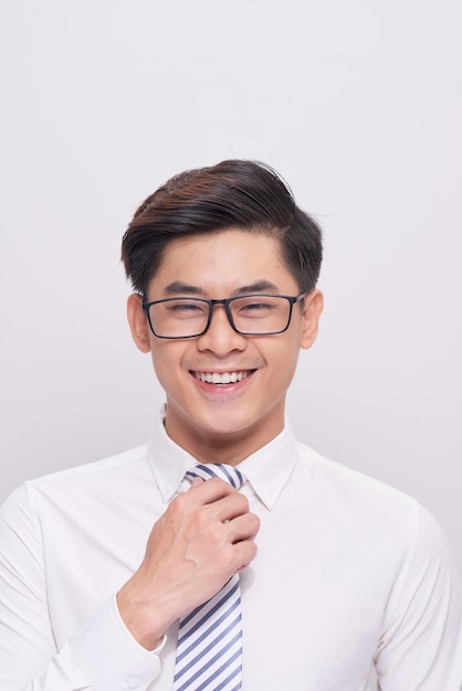 Handsome young asian business man smiling