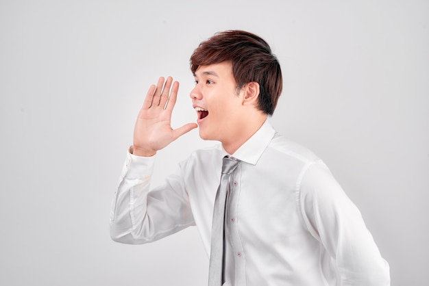 Handsome young business man happy smile wear elegant suit and tie isolated over white background