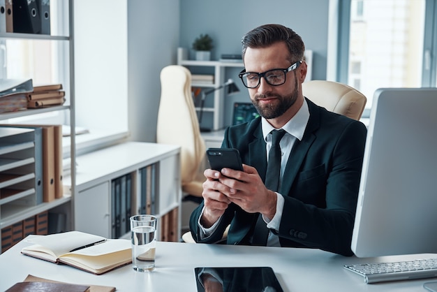 Handsome young businessman working on the desk