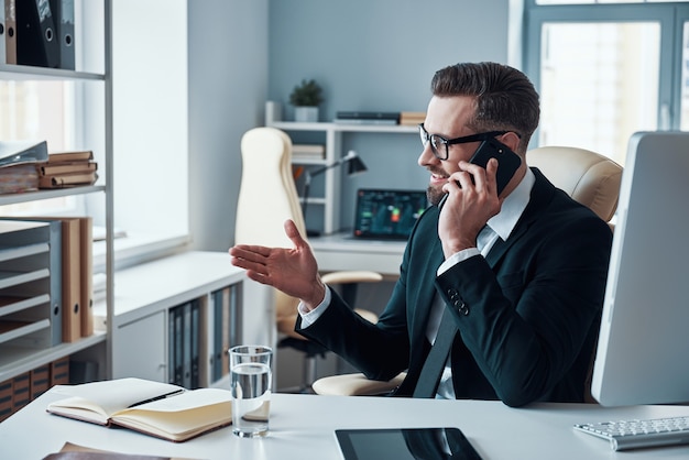 Handsome young businessman working on the desk