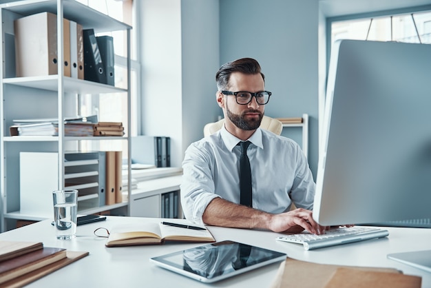 Handsome young businessman working on the desk