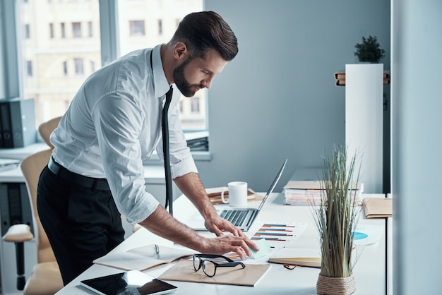 Handsome young businessman working on the desk