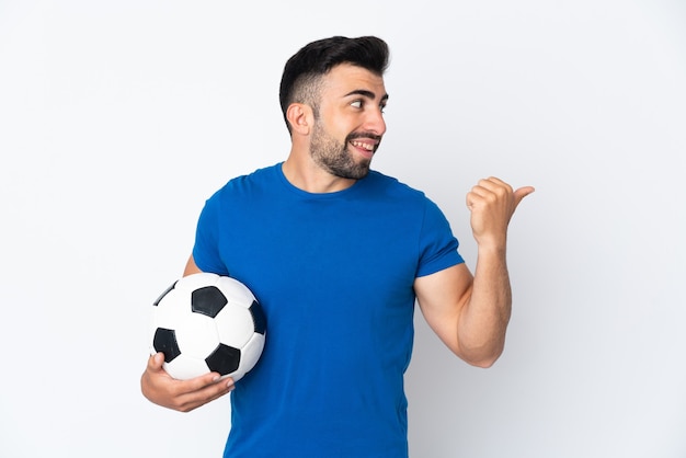 Handsome young football player man isolated