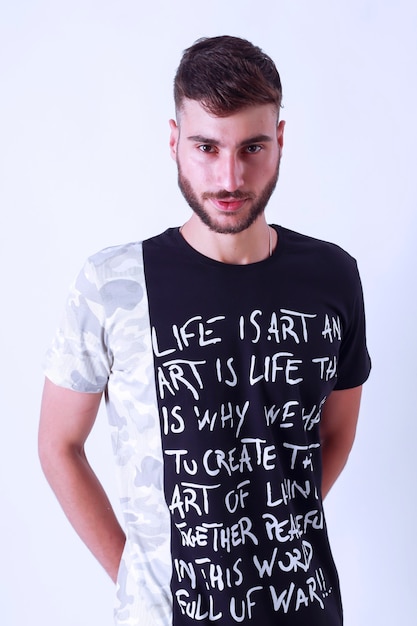 Photo handsome young guy posing in studio  isolated