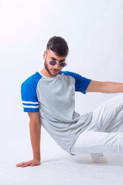 Handsome young guy posing in studio  isolated