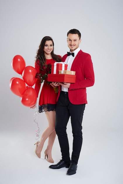 Handsome young man delighting his woman with gifts