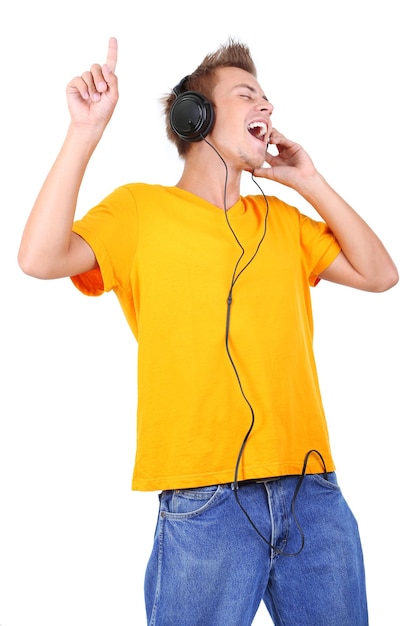 Handsome young man listening to music isolated on white