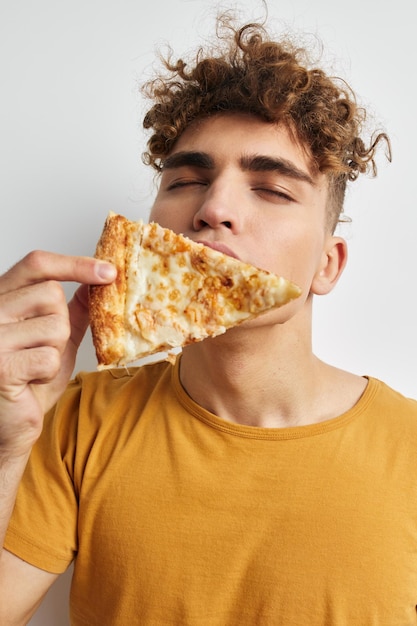 Handsome young man pizza snack fast food Lifestyle unaltered