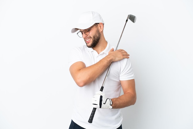 Handsome young man playing golf  isolated on white background suffering from pain in shoulder for having made an effort