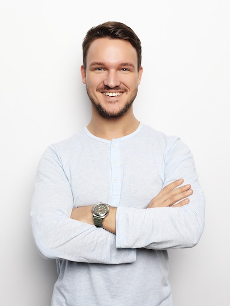 Handsome young man in smart casual wear looking at camera