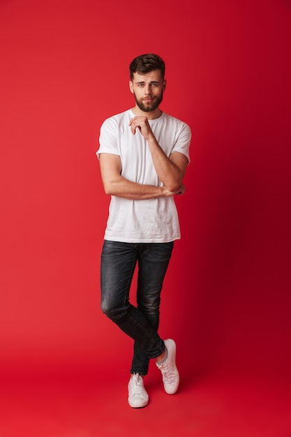 Handsome young man standing isolated