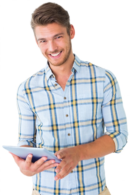 Handsome young man using his tablet pc