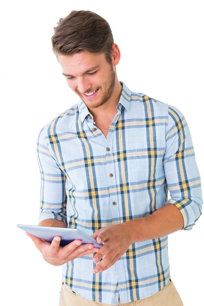 Handsome young man using his tablet pc