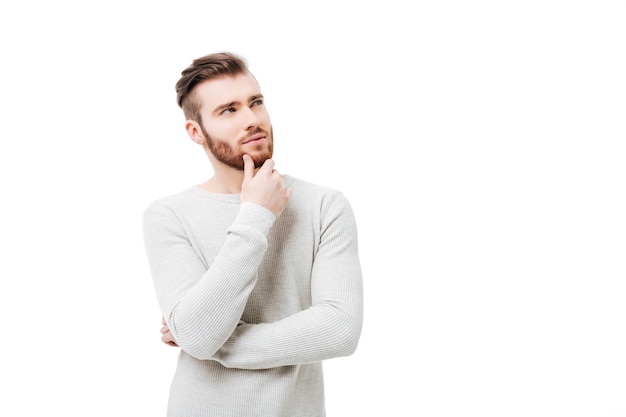 Handsome young man in a white sweater