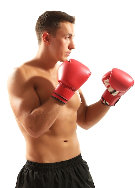 Handsome young muscular sportsman with boxing gloves isolated on white