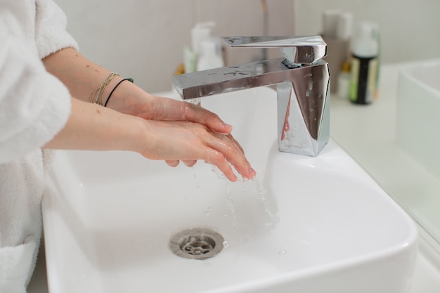 Handwashing with soap for hygiene disease prevention healthy lifestyle stop coronavirus high quality photo