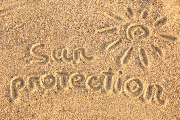 Handwritten inscription on sea sand close up view