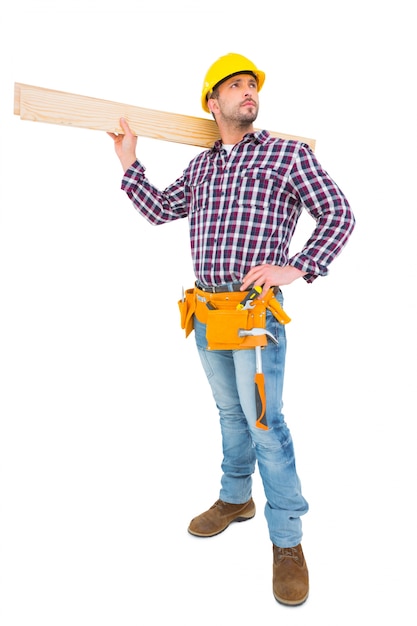 Handyman holding wood planks