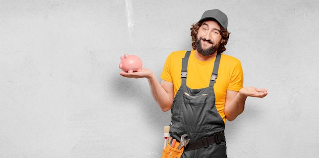 Handyman worker  with a piggy bank