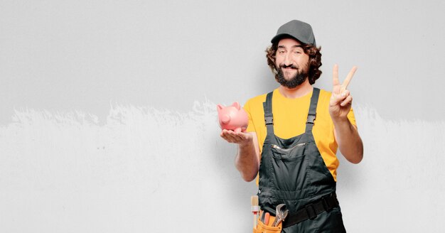 Handyman worker  with a piggy bank