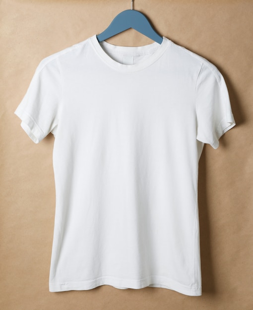 Hanger with blank white t-shirt on cardboard