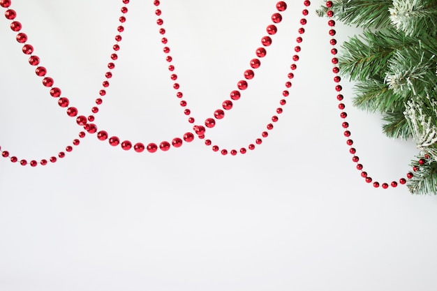 Hanging red ball Christmas garland with fir tree branch