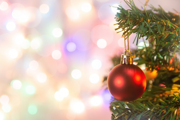 Hanging red balls on Christmas pine branches