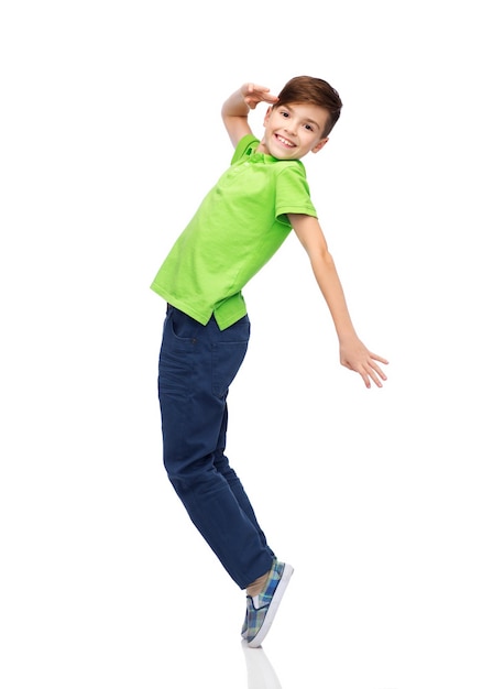 happiness, childhood, freedom, movement and people concept - smiling boy having fun or dancing