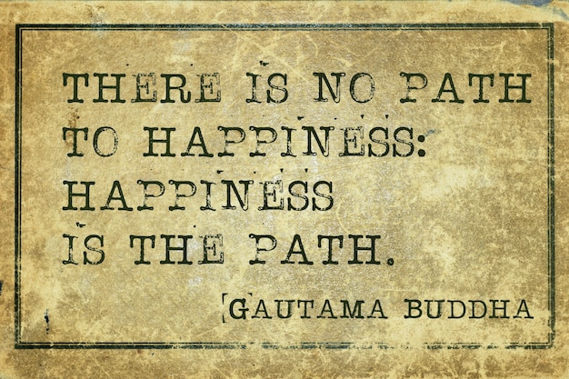 Happiness is the path - famous Buddha quote printed on grunge vintage cardboard