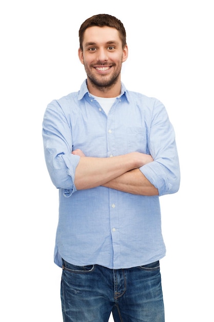 happiness and people concept - smiling man with crossed arms