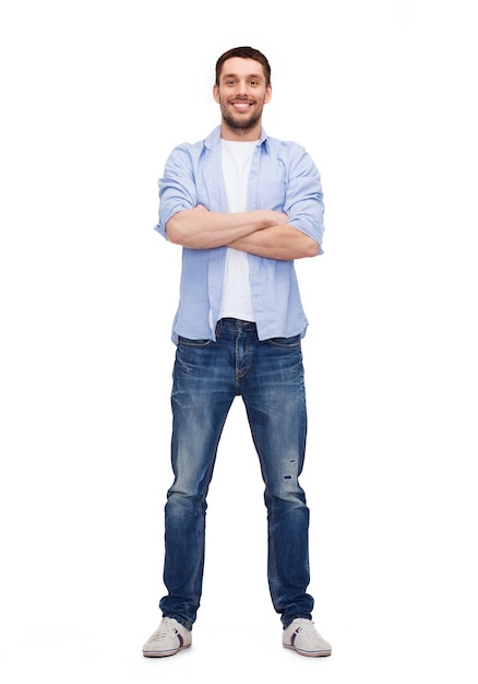 happiness and people concept - smiling man with crossed arms