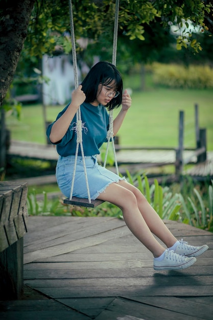 Happiness smiling face of asian teenager in open park