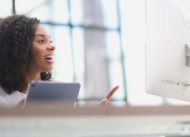 Happy african american businesswoman using digital tablet