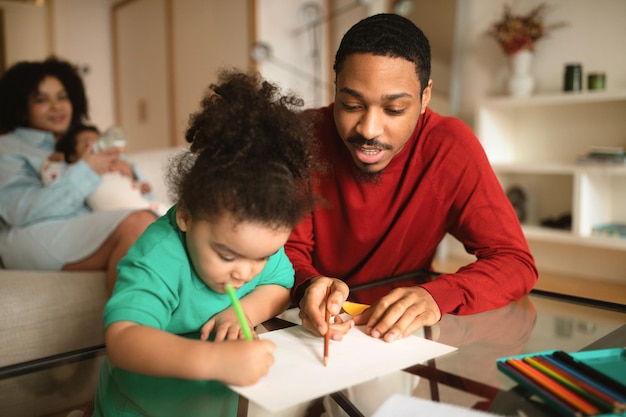 Happy african american family spending time together at home