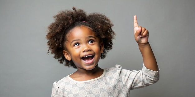 Happy African American Girl Pointing Up Idea Warning and Childhood Concept