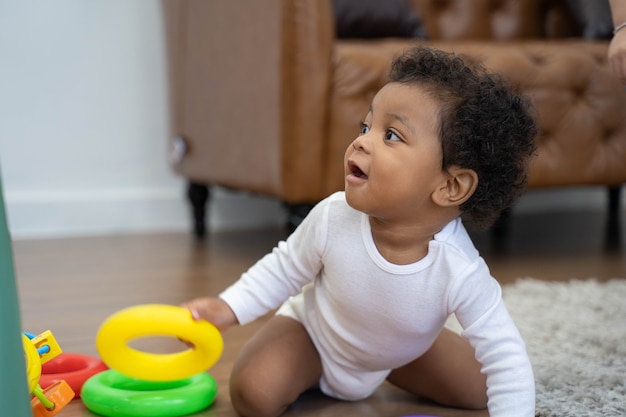 Happy African American Little baby boy crawling and looking for some thing to learn