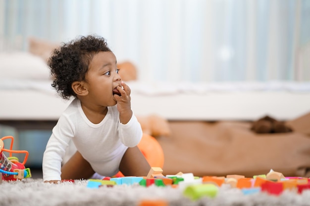 Happy African American Little baby boy crawling and looking for some thing to learn