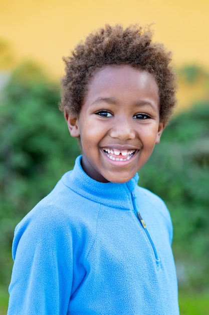 Happy african child with blue jersey