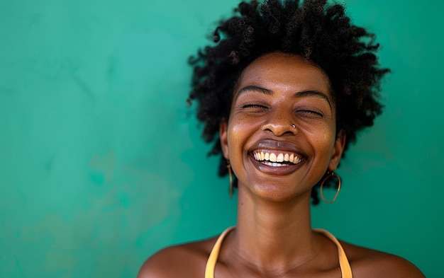 A Happy African Woman Smiling Against a Green Background