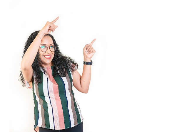 Happy afro young woman pointing an advertising side Beautiful afro girl pointing to a banner to the side Happy people pointing a promo isolated