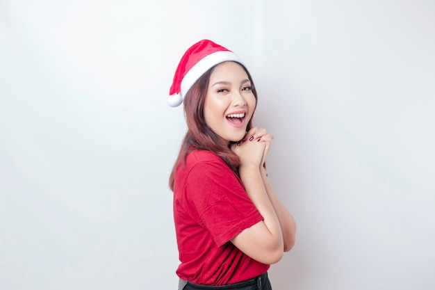 Happy Asian Santa woman is smiling isolated by white background Christmas concept