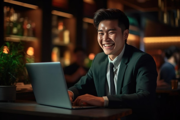 Happy Asian woman in formal office clothes working happily on her laptop in modern