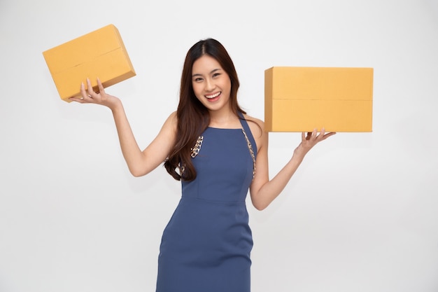 Happy Asian woman holding package parcel box.