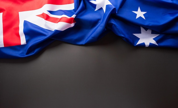 Happy Australia day concept Australian flag against dark background 26 January