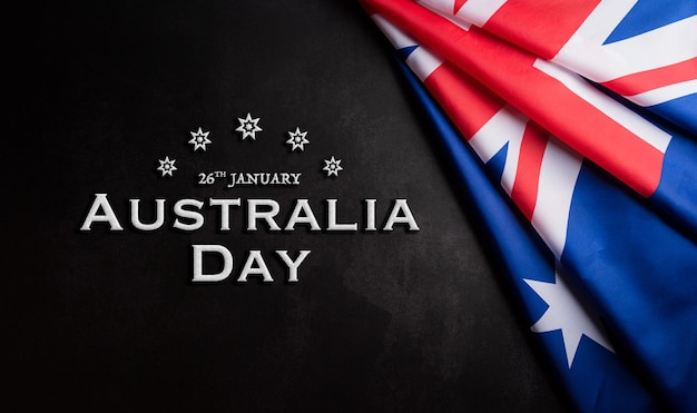 Happy Australia day concept. Australian flag against dark stone background. 26 January.